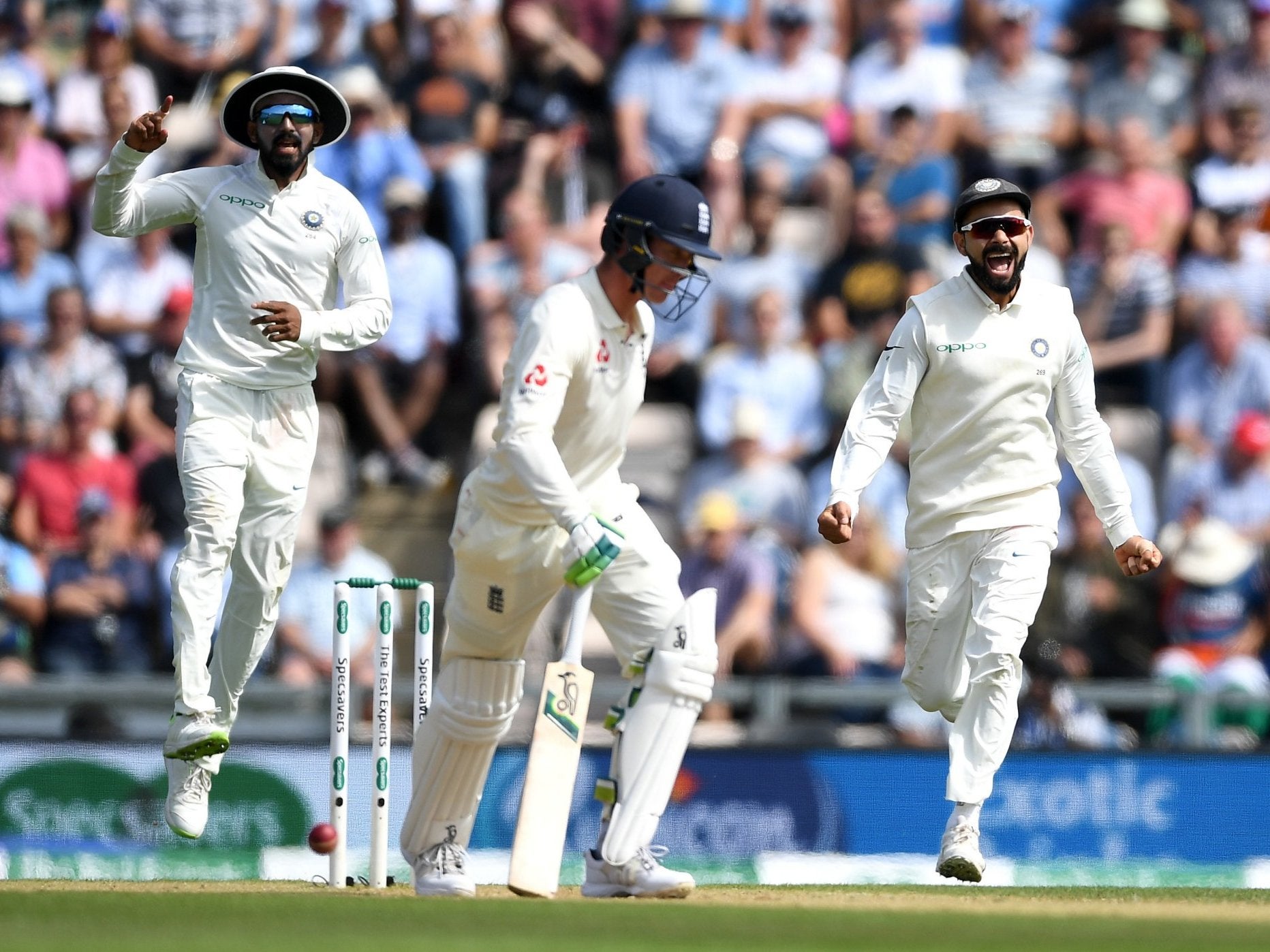 Virat Kohli, right, celebrates the wicket of Keaton Jennings