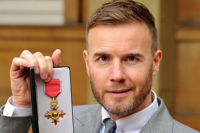 Gary Barlow, who was awarded an OBE for services to the entertainment industry and to charity