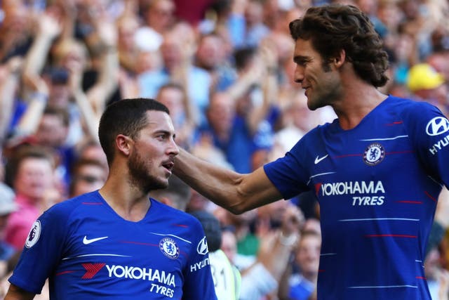 Eden Hazard of Chelsea celebrates with teammate Marcos Alonso