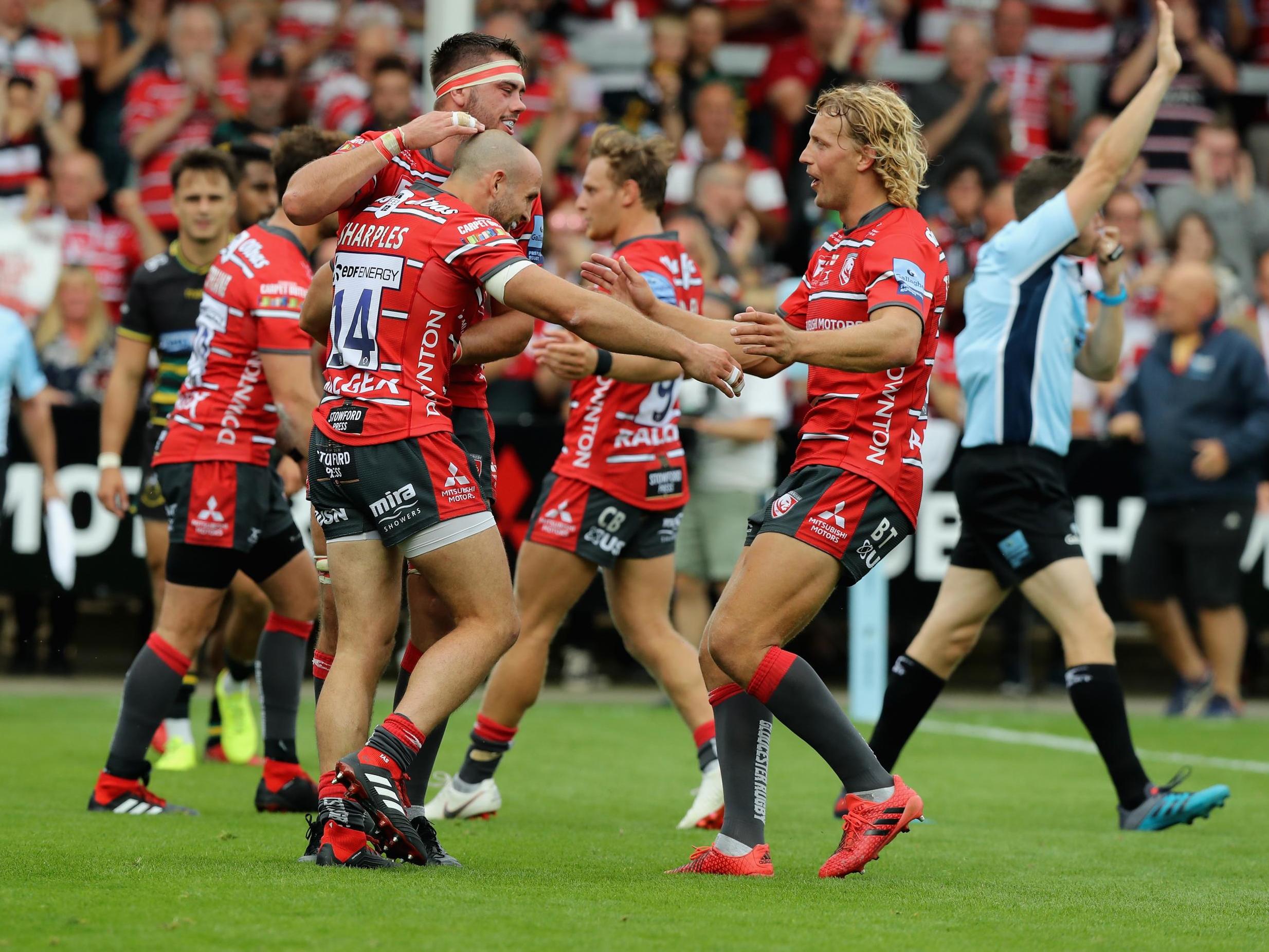 Gloucester celebrate after Charlie Sharples scored one of their two tries