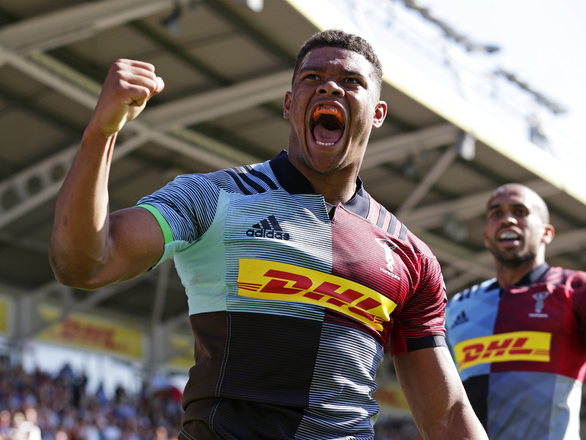 Nathan Earle celebrates scoring a try on his Harlequins debut in the win over Sale Sharks