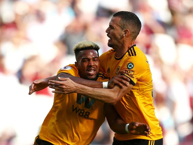 Adama Traore of Wolverhampton Wanderers celebrates with teammate Leo Bonatini