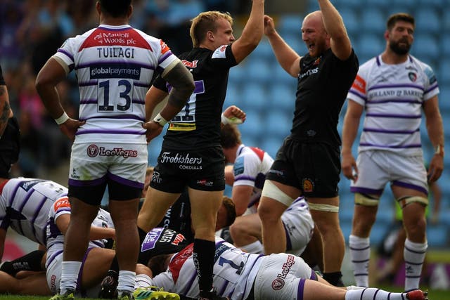 Exeter celebrate a try during their rout of Leicester