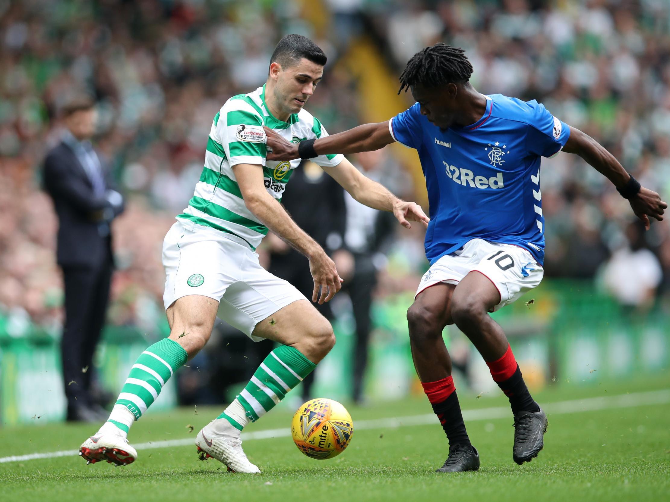 Tomas Rogic and Ovie Ejaria tussle for possession