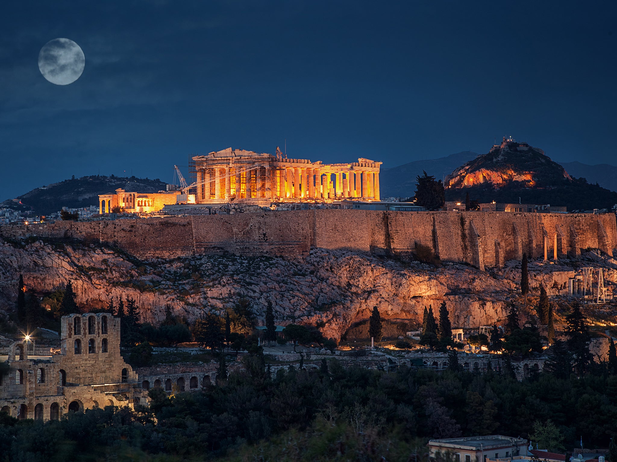 The Parthenon lit up at night is a spectacular sight