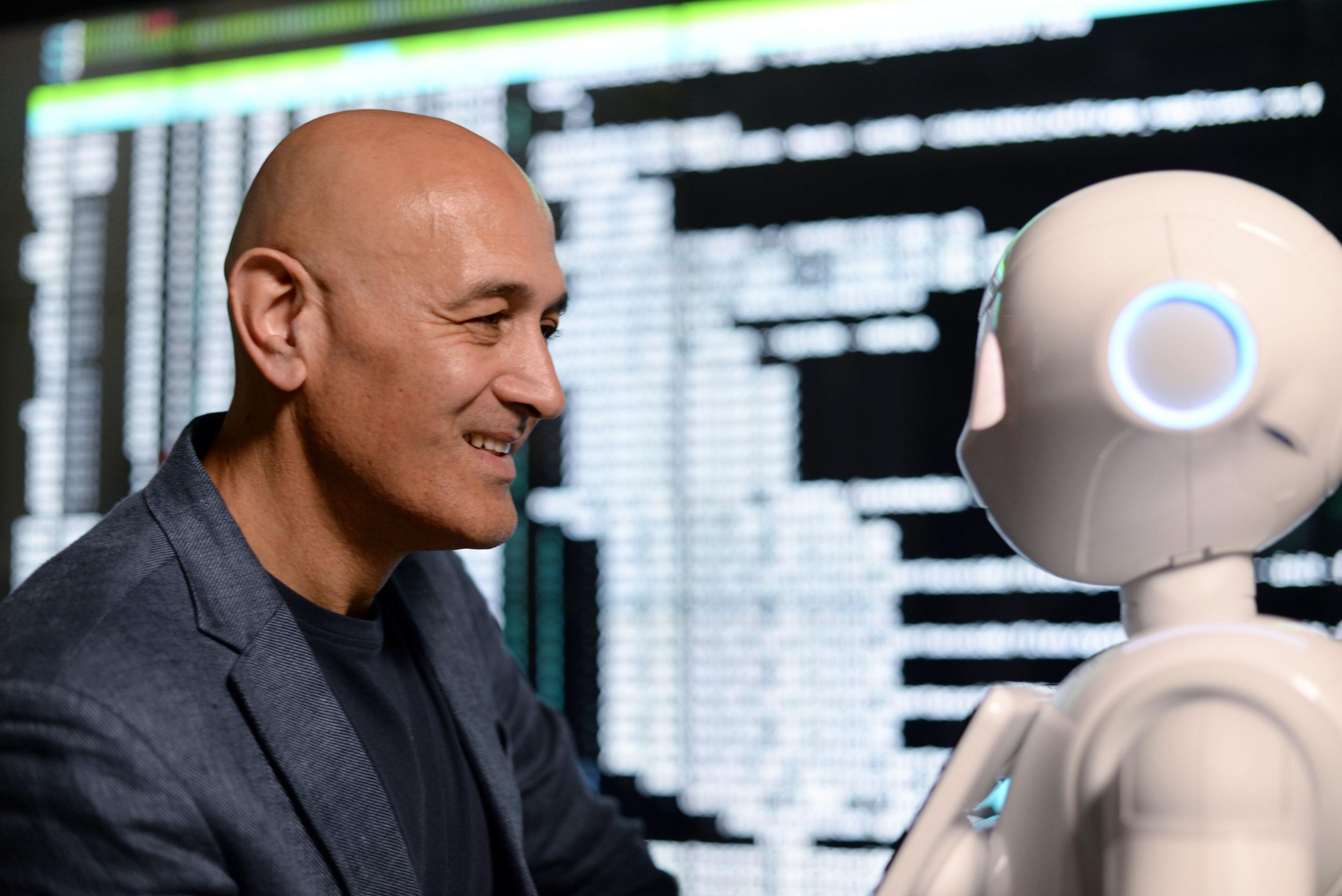 Automatic for the people: Professor Jim Al-Khalili converses with an AI-equipped robot