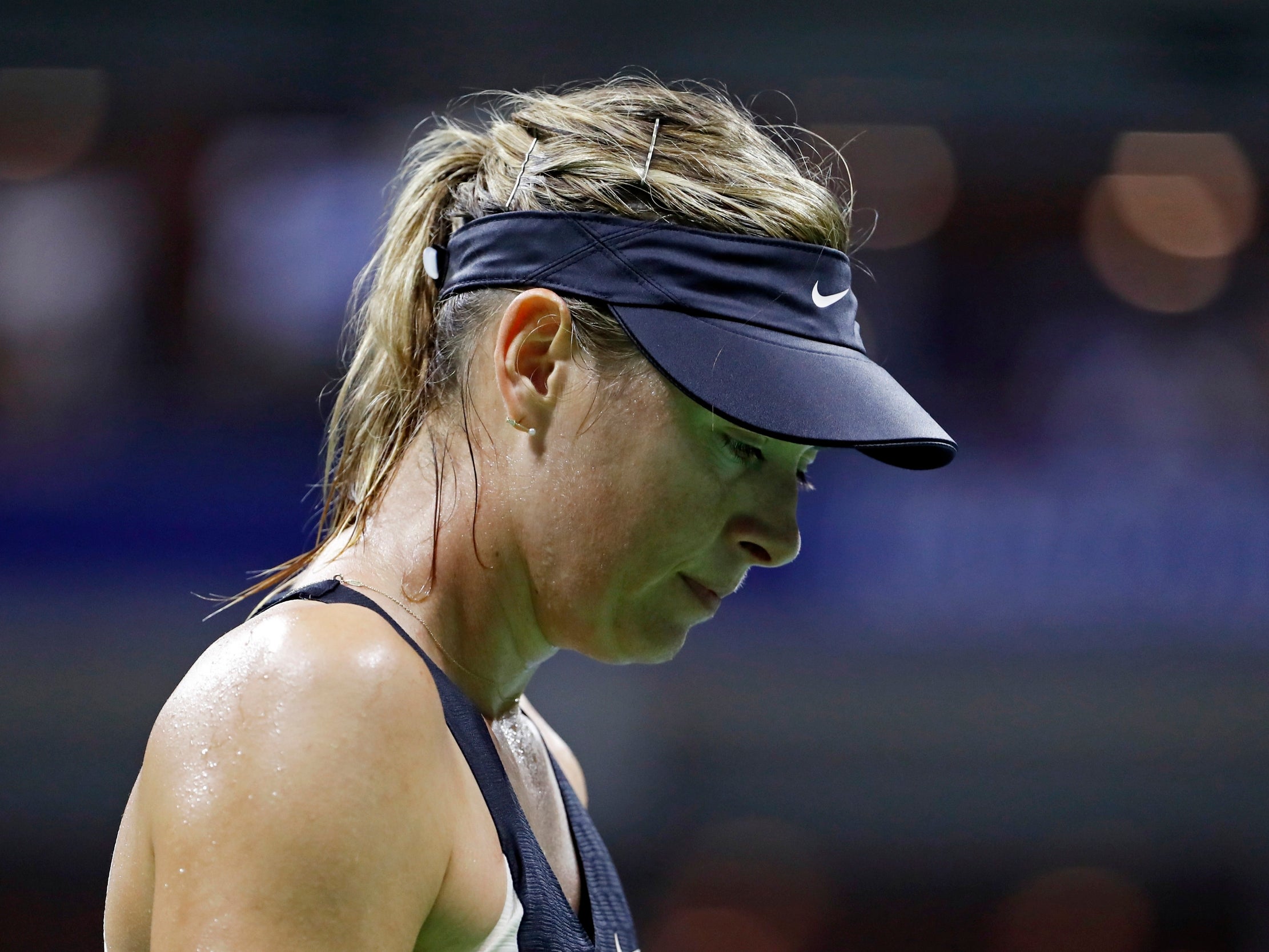 Maria Sharapova suffered a straight-sets defeat by Carla Suarez Navarro