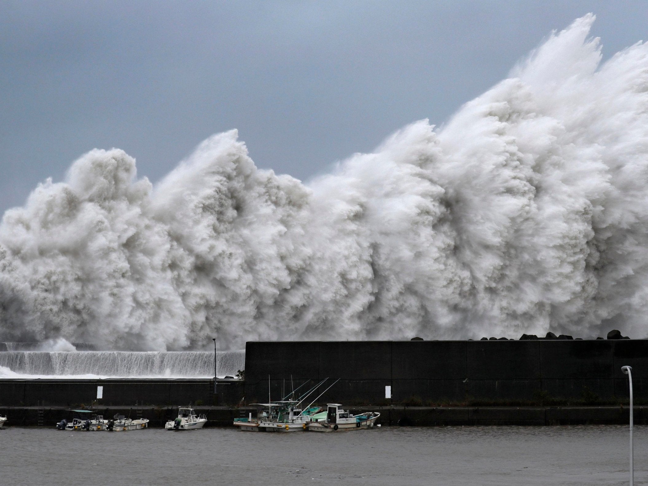 High waves hit breakwaters at a port of Aki, Kochi prefecture, as typhoon Jebi hits Japan