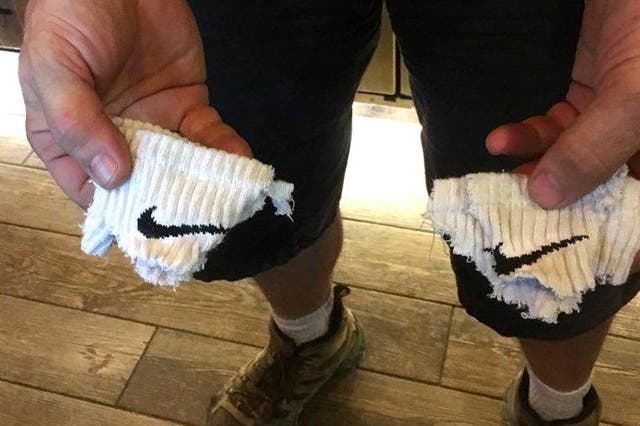 A sound engineer for the country music duo Big and Rich cut the Nike swoosh off his socks