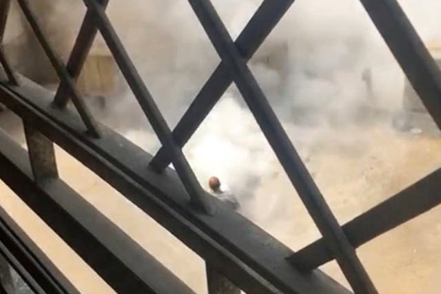 Smoke rises outside of the heavily fortified US embassy compound in Cairo