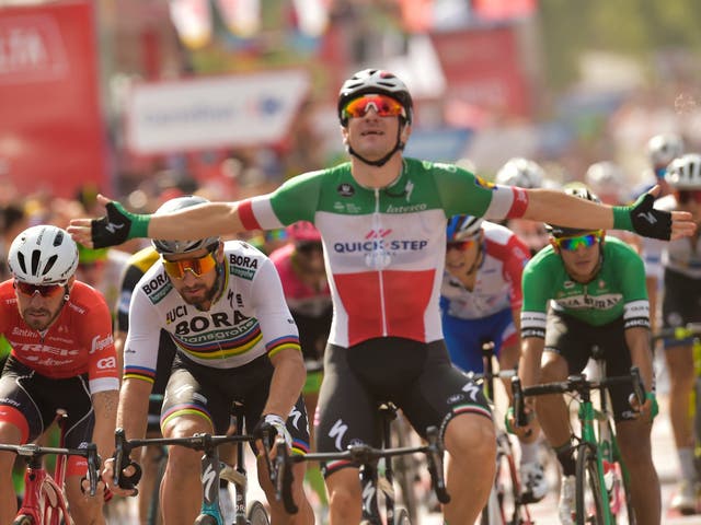 Elia Viviani celebrates after beating Peter Sagan to the line