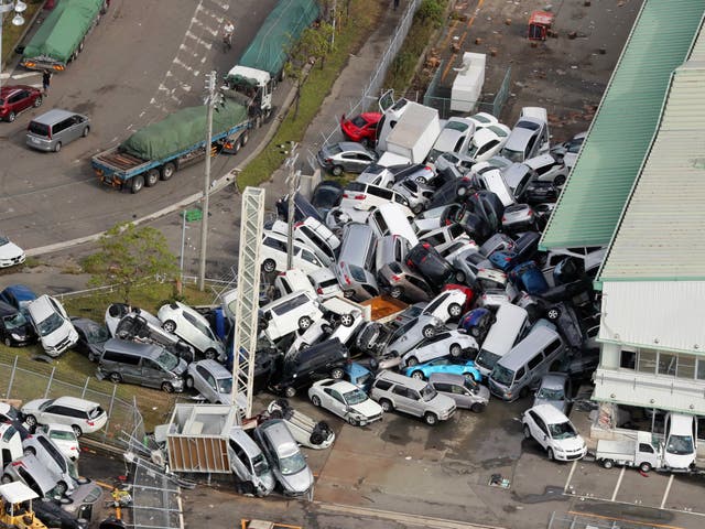 An aerial picture shows cars piled up a day after powerful Typhoon Jebi hit the area in Kobe, western Japan