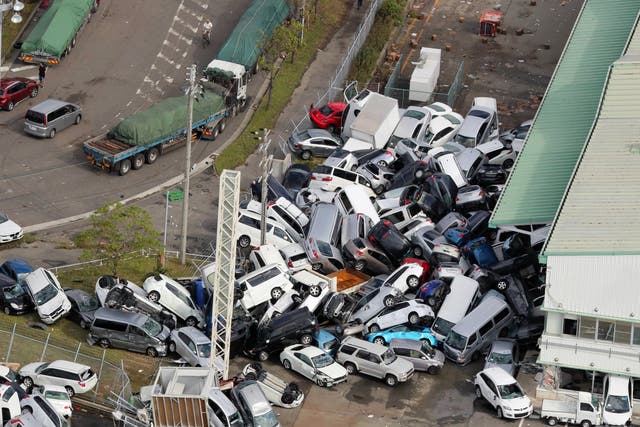 An aerial picture shows cars piled up a day after powerful Typhoon Jebi hit the area in Kobe, western Japan