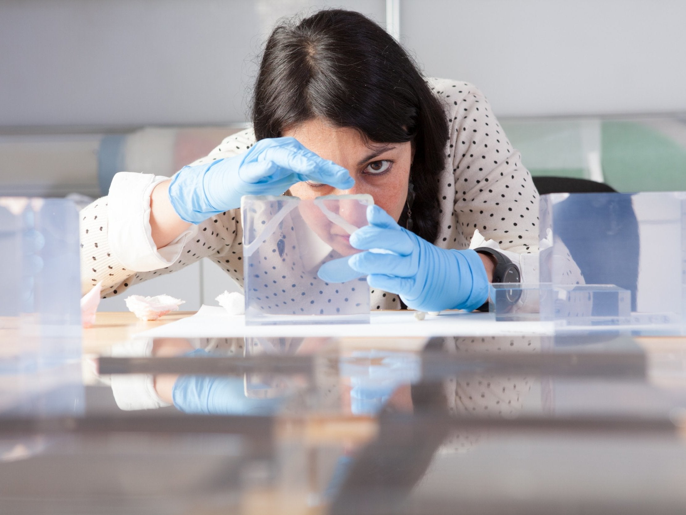 Source material: Anna Lagana tries to identify what kind of plastic she is dealing with (J Paul Getty Trust)