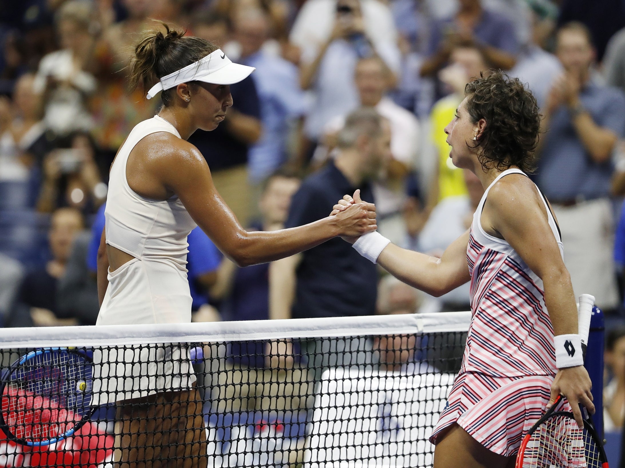 The two shake hands after their quarter-final