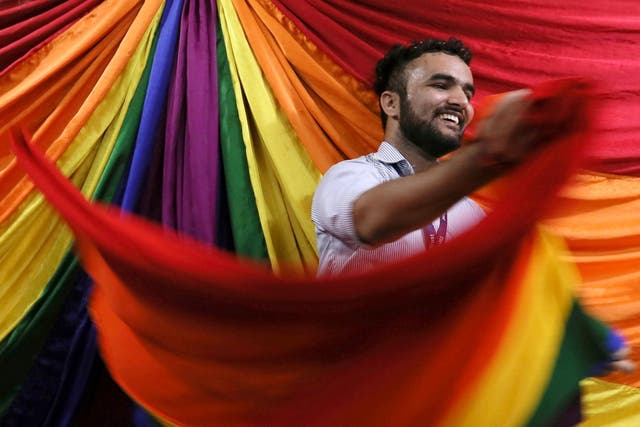 An Indian activist of the LGBT+ community reacts after the hearing at the Supreme Court