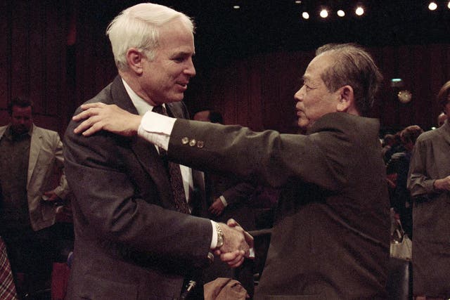 Bui Tin meets John McCain at a Senate hearing on prisoners of war and missing in action soldiers in 1992