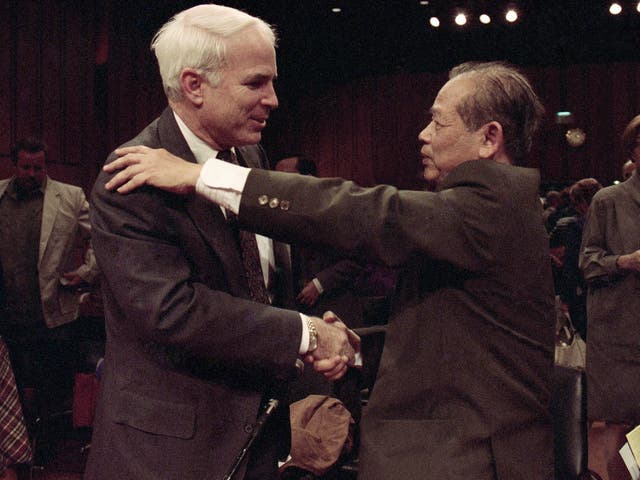 Bui Tin meets John McCain at a Senate hearing on prisoners of war and missing in action soldiers in 1992
