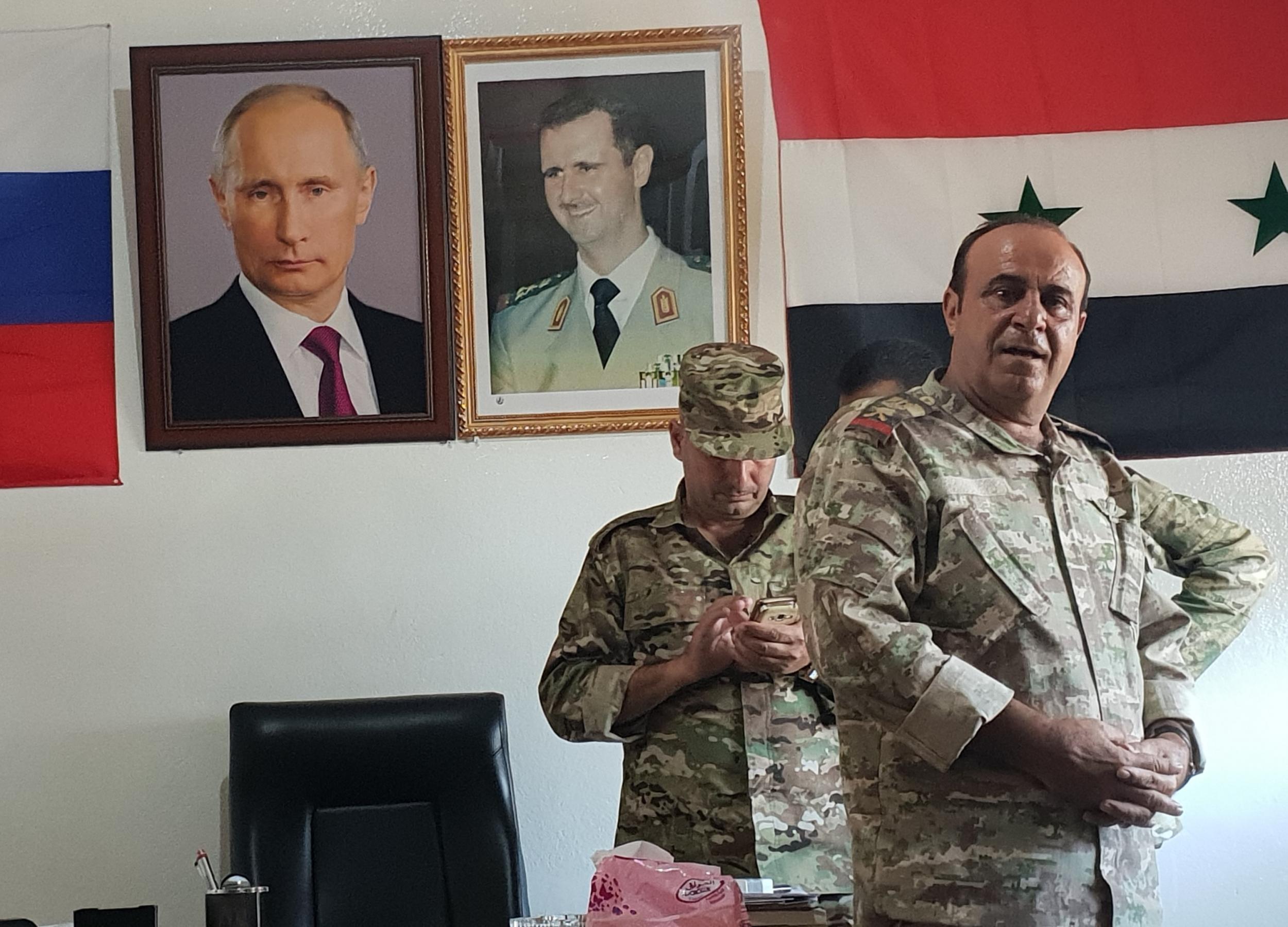 Beneath photos of Putin and Assad, General Jihad Sultan (foreground). Photo: Nelofer Pazira