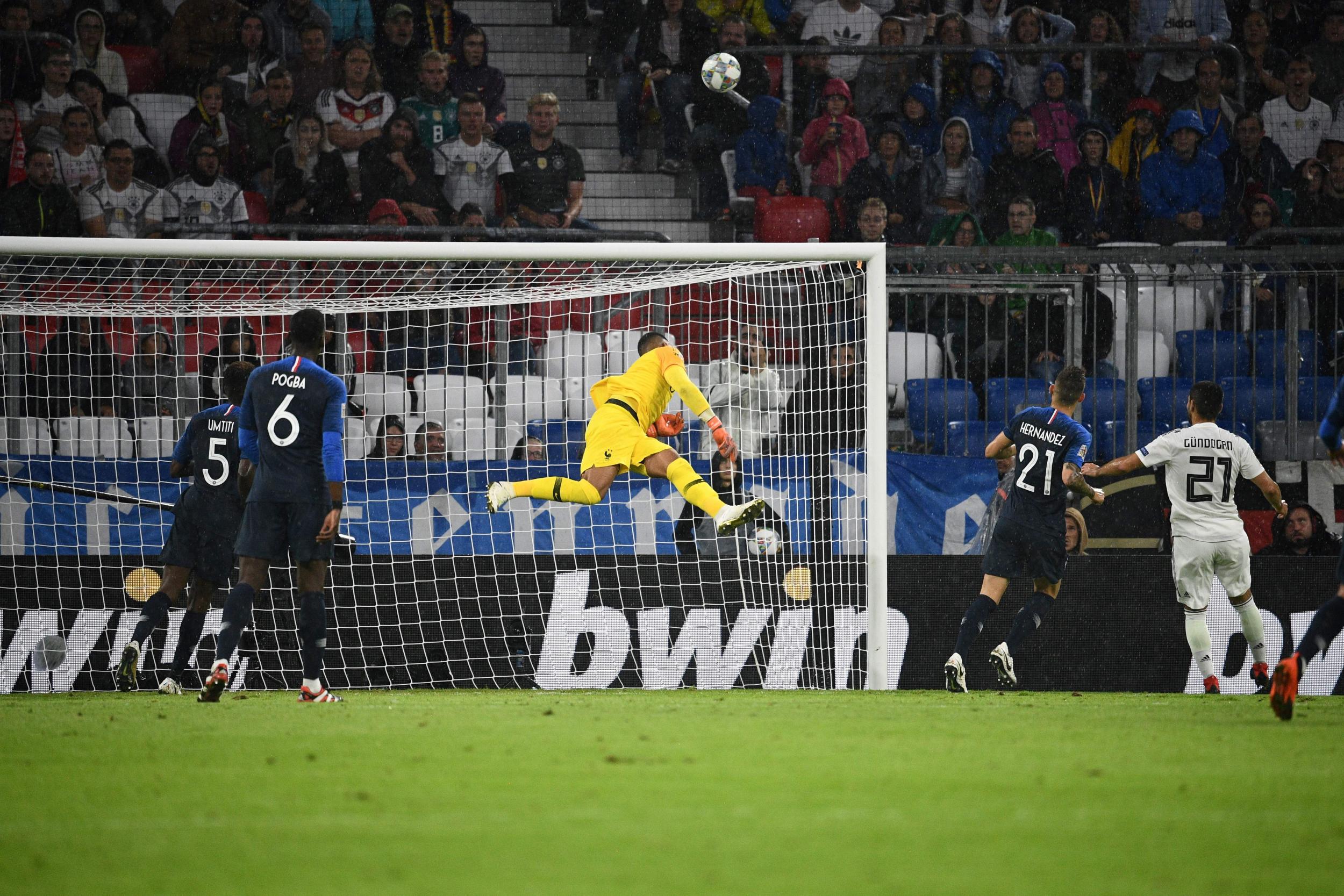 Alphonse Areola jumps into action for France after a German shot on goal