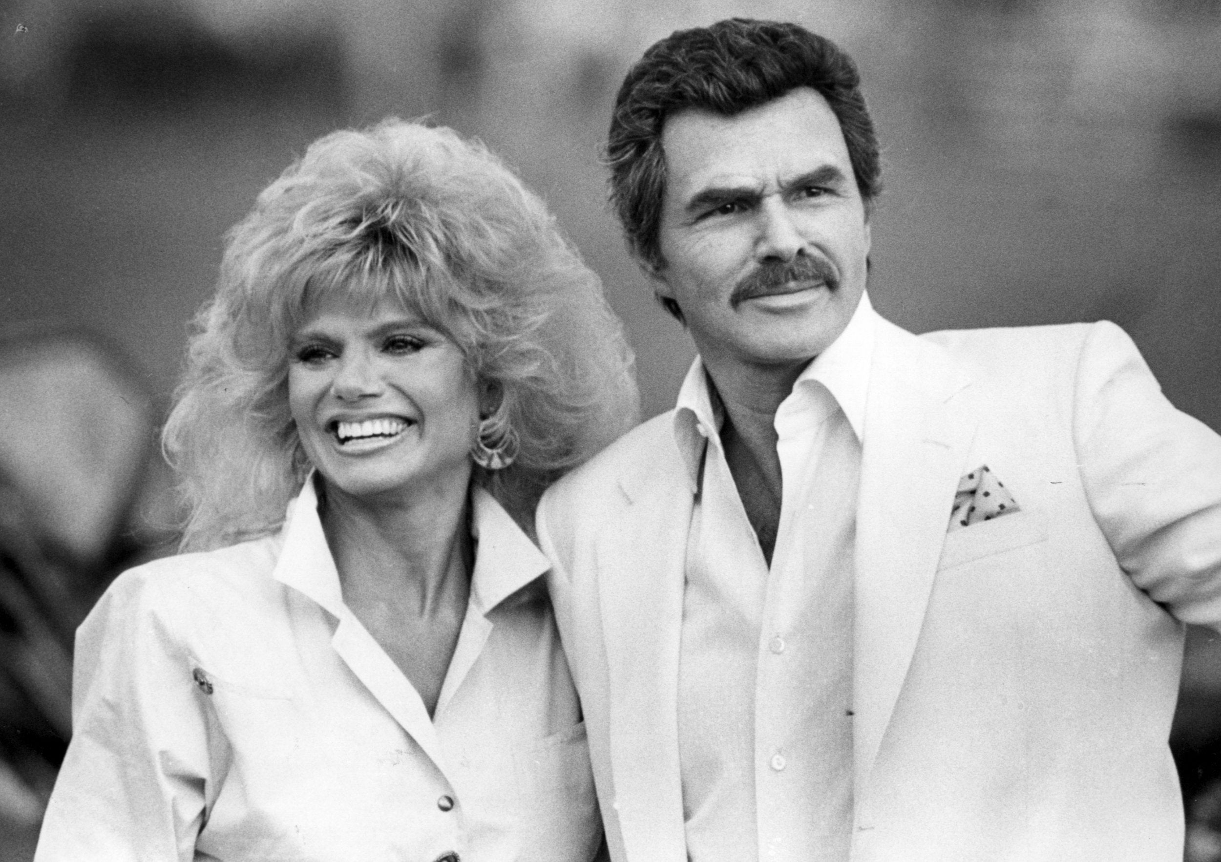 Reynolds and his second wife Loni Anderson at a polo match in 1987