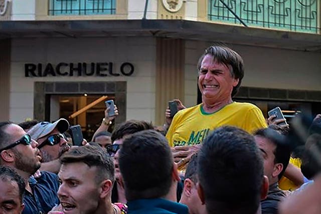Jair Bolsonaro was stabbed while being held aloft at a campaign rally in Juiz de Fora
