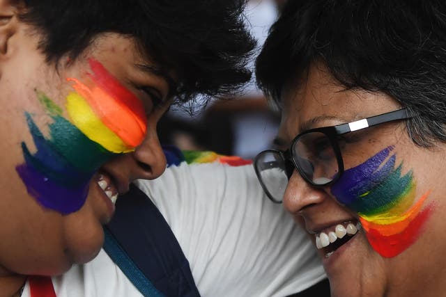 Two women in India celebrate a Supreme Court decision in September to strike down a colonial-era ban on gay sex