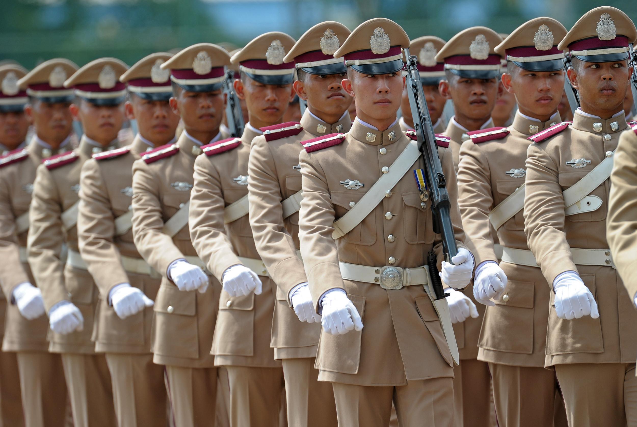 Thai police officers parade at Royal Police Cadet Academy in Nakorn Prathom province on 13 October 2010