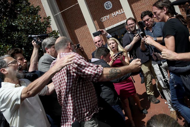 A counter protester identified as Jefrrey Winder punches Jason Kessler, organiser of 'Unite the Right' rally, after Kessler tried to speak outside the Charlottesville City Hall on August 13, 2017 in Charlottesville, Virginia.