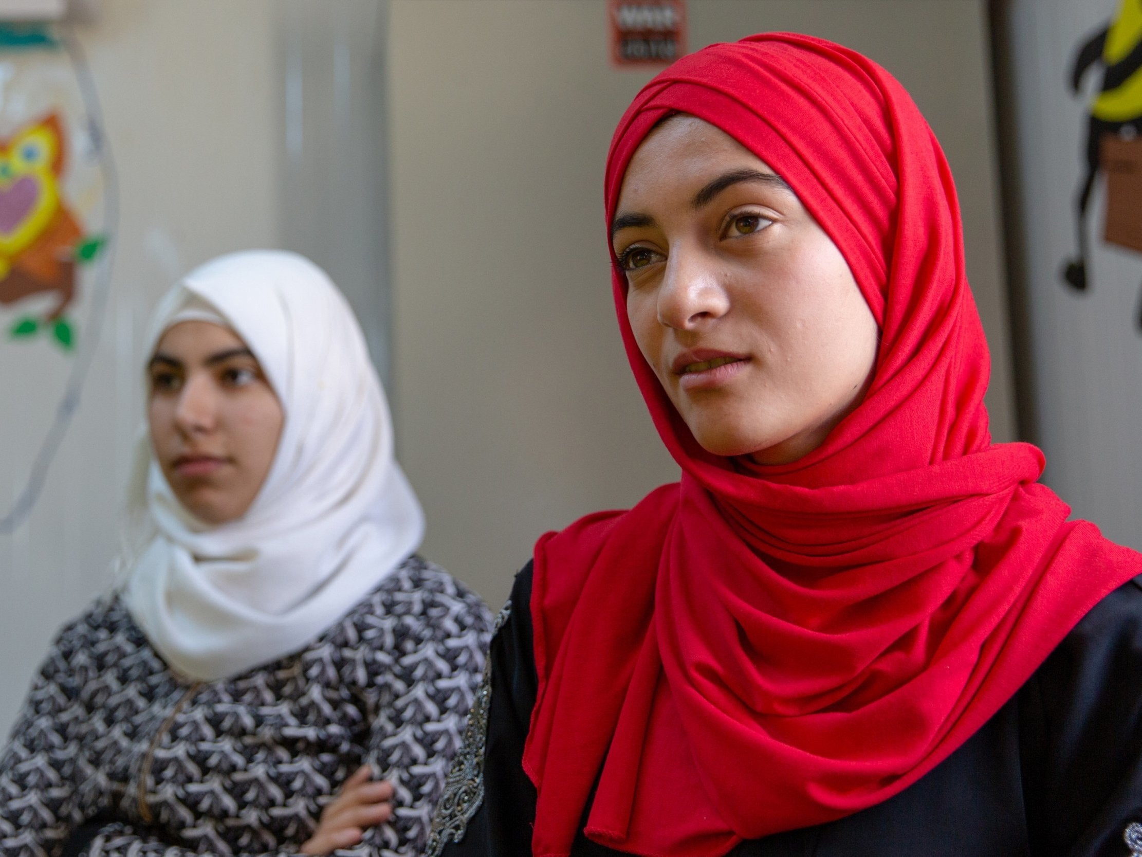 Syrian refugees Areej and Rula at a War Child activity centre in Zaatari refugee camp, northern Jordan