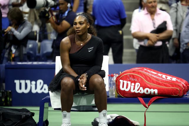 Serena Williams looks on after suffering defeat