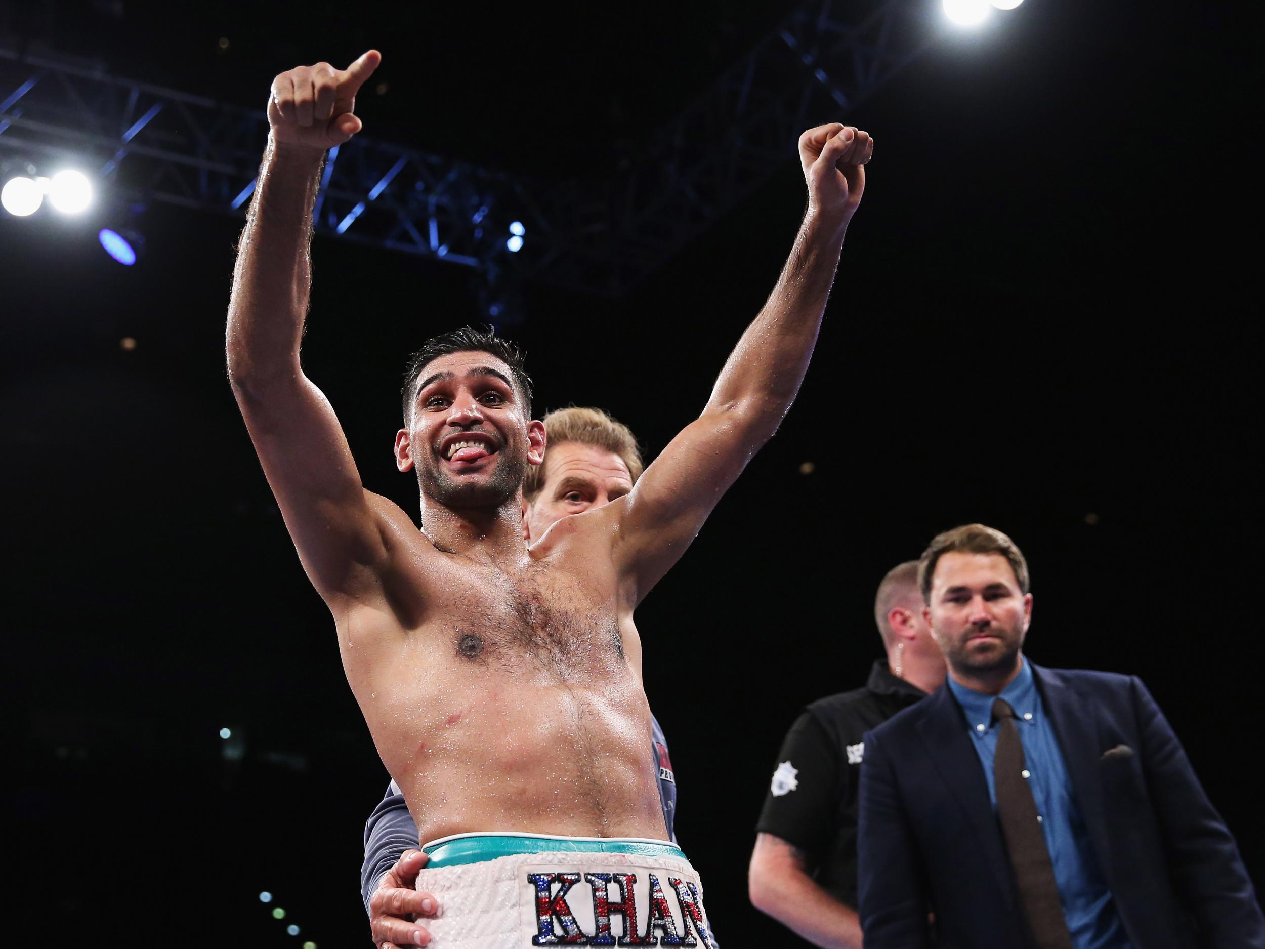 Khan survived an early knockdown to win on points