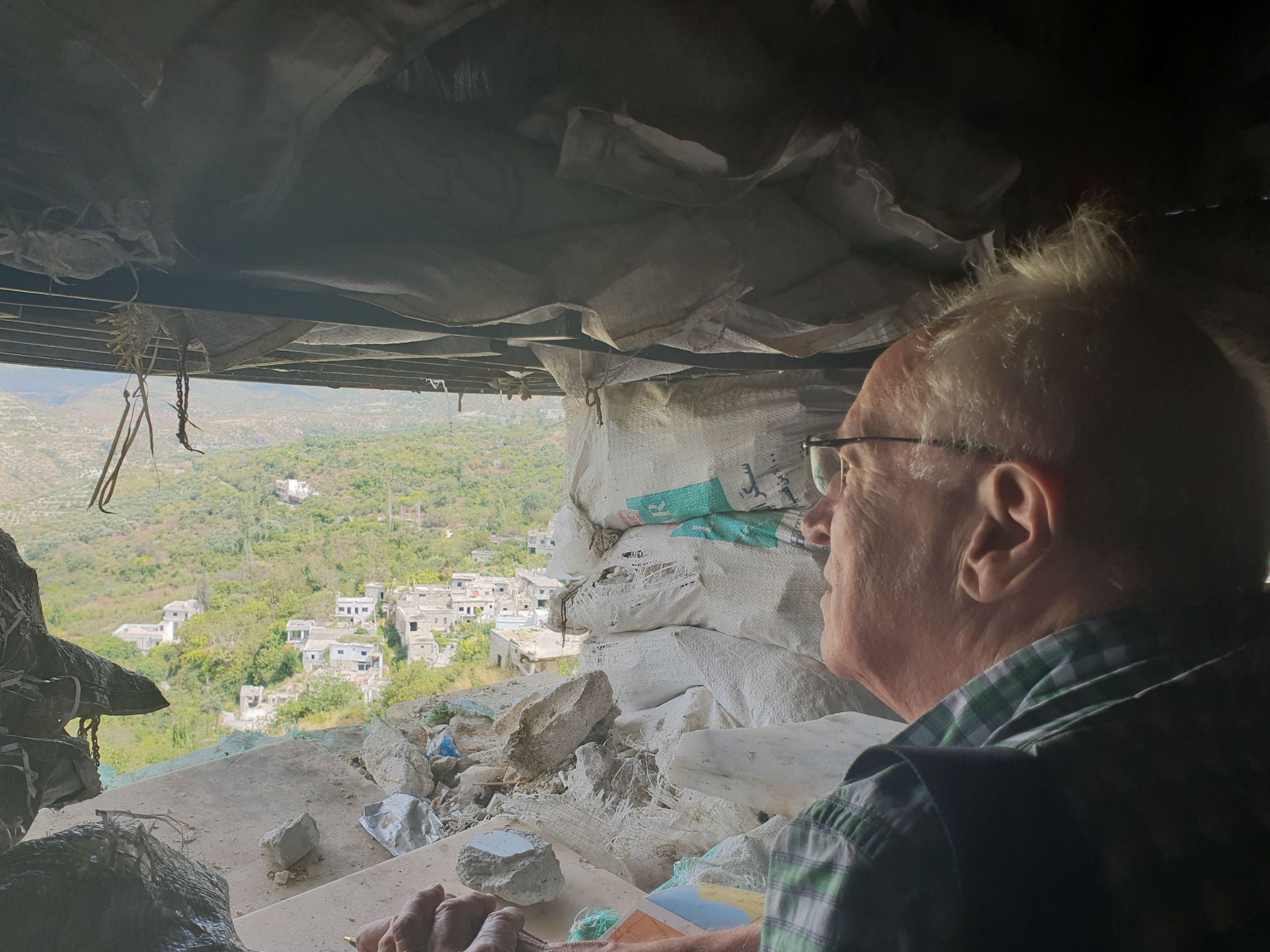 The Independent’s Robert Fisk looks towards Nusrah positions from a Syrian army post on the edge of Idlib province