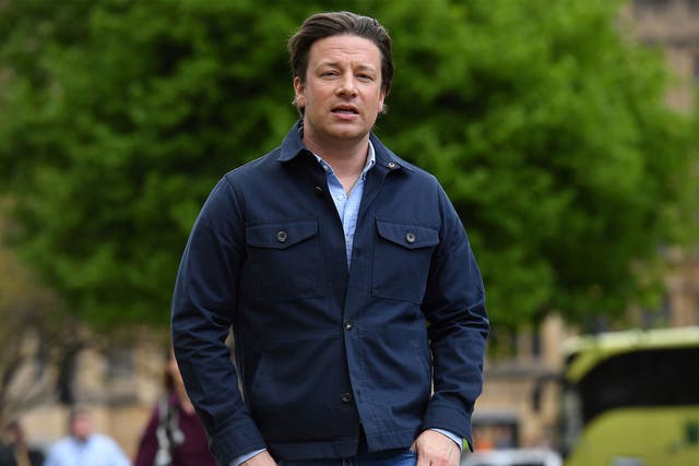 British chef and activist Jamie Oliver arrives to speak to members of the media after speaking on the subject of childhood obesity at Parliament's Health and Social Care Committee in London on 1 May 2018