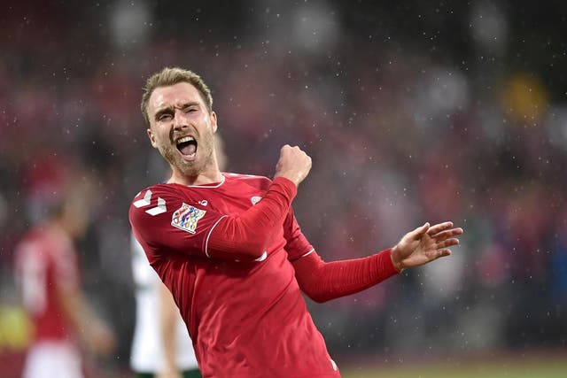 Christian Eriksen celebrates scoring his first against Wales over the weekend