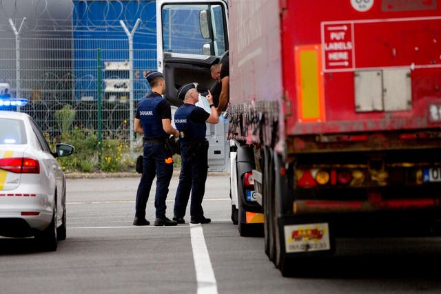 A truck is checked by customs officers at a checkpoint in Zeebrugge