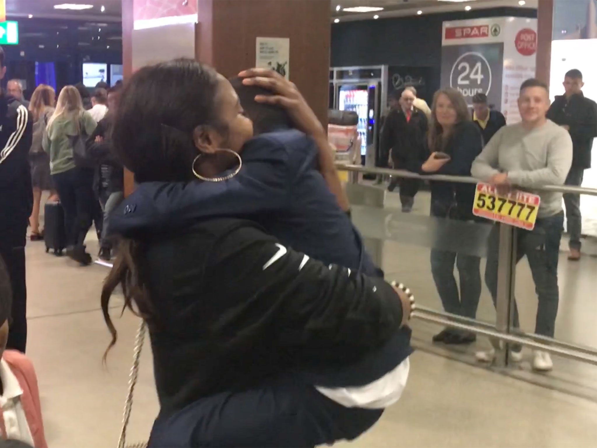 Hawa Keita embraces her son Mohamed at Manchester airport