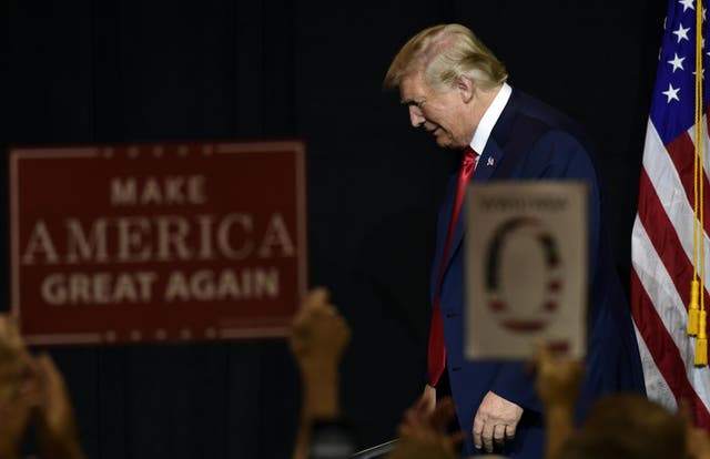 President Donald Trump walks off of the stage following a fundraiser in Sioux Falls, South Dakota