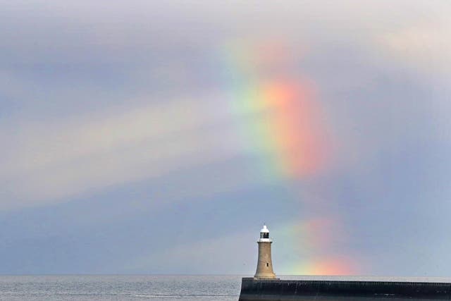 A rainbow over Tynemouth lighthouse in Northumberland
