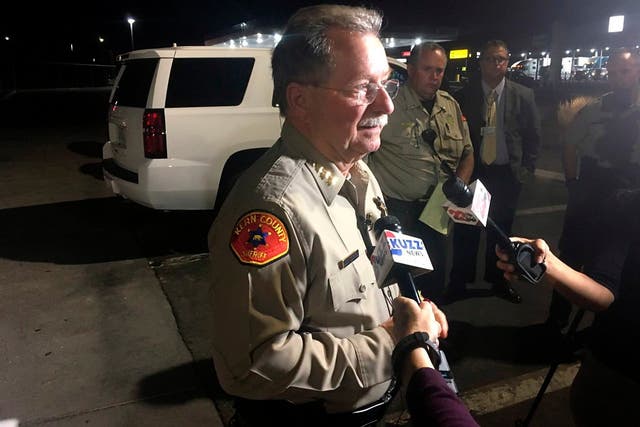 Kern County Sheriff Donny Youngblood talks to the media in southeast Bakersfield, California, where authorities say a gunman killed multiple people