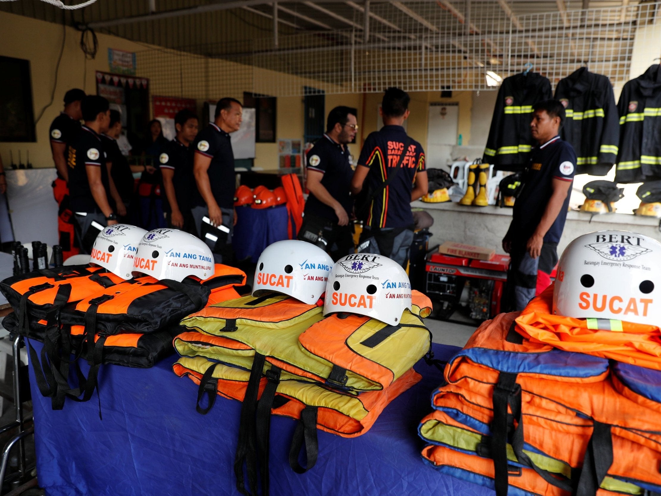 Rescuers ready their gear before Super Typhoon Mangkhut hits the main island of Luzon, in Manila