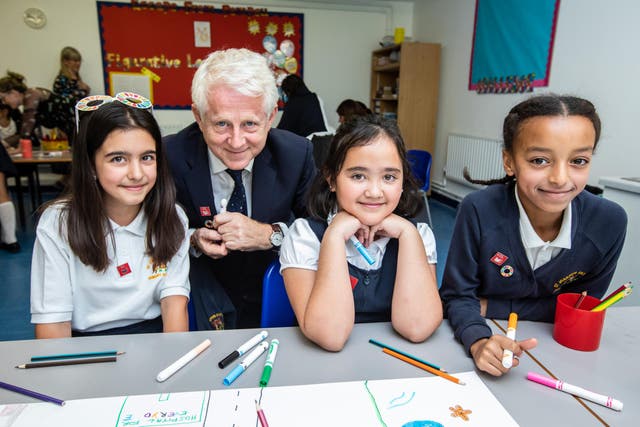 Filmmaker Richard Curtis with Diana, Nicole, Nibiruand and Isabella at St Joseph’s RC Primary School in Putney, south London