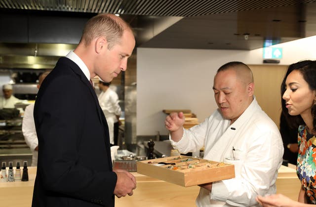 Prince William is presented with a bento box by chef Akira Shimizu