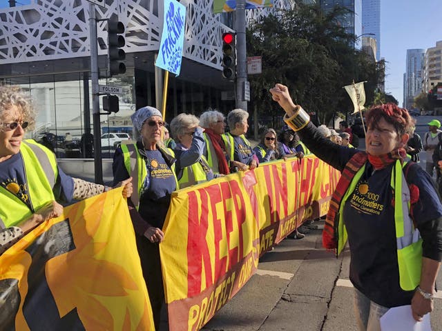 <p>Protesters gather outside the Global Climate Action Summit in San Francisco</p>