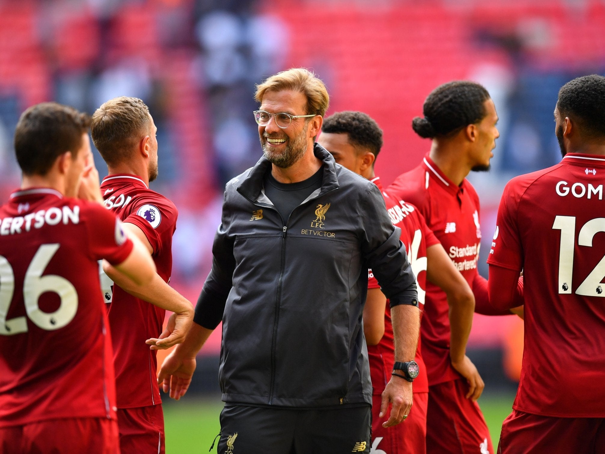 Jurgen Klopp celebrates with his players after Liverpool's win