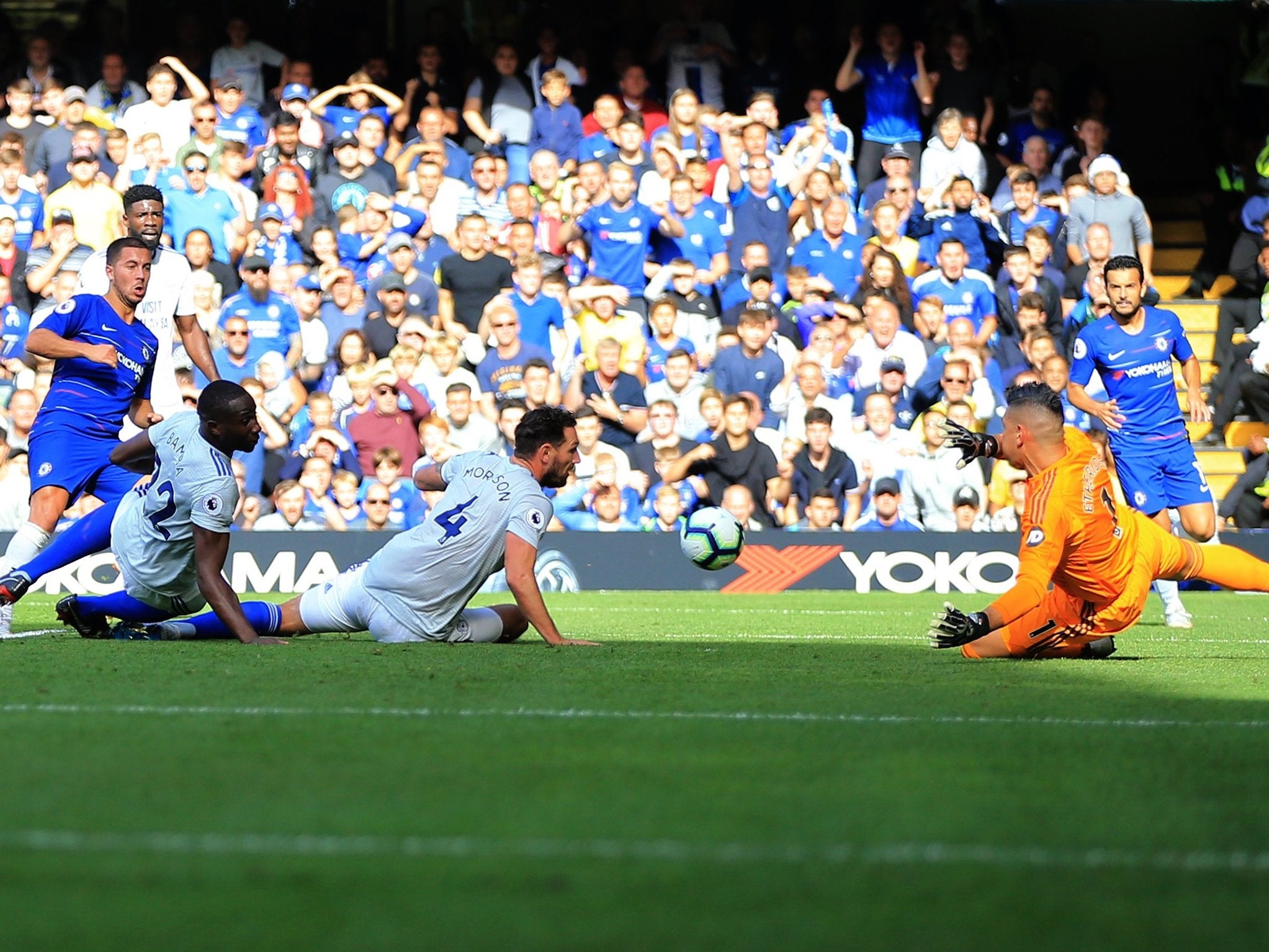 Eden Hazard tucks the ball past the Cardiff defence and goalkeeper Neil Etheridge to score his second goal