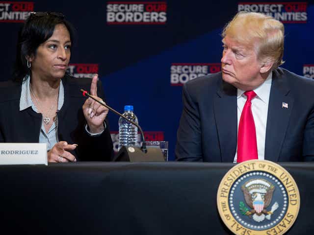 Evelyn Rodriguez speaks alongside Donald Trump during a roundtable discussion on immigration in New York in May 2018