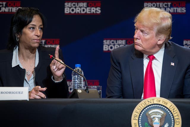 Evelyn Rodriguez speaks alongside Donald Trump during a roundtable discussion on immigration in New York in May 2018