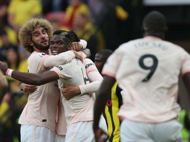 Marouane Fellaini celebrates with teammates after Romelu Lukaku's opener