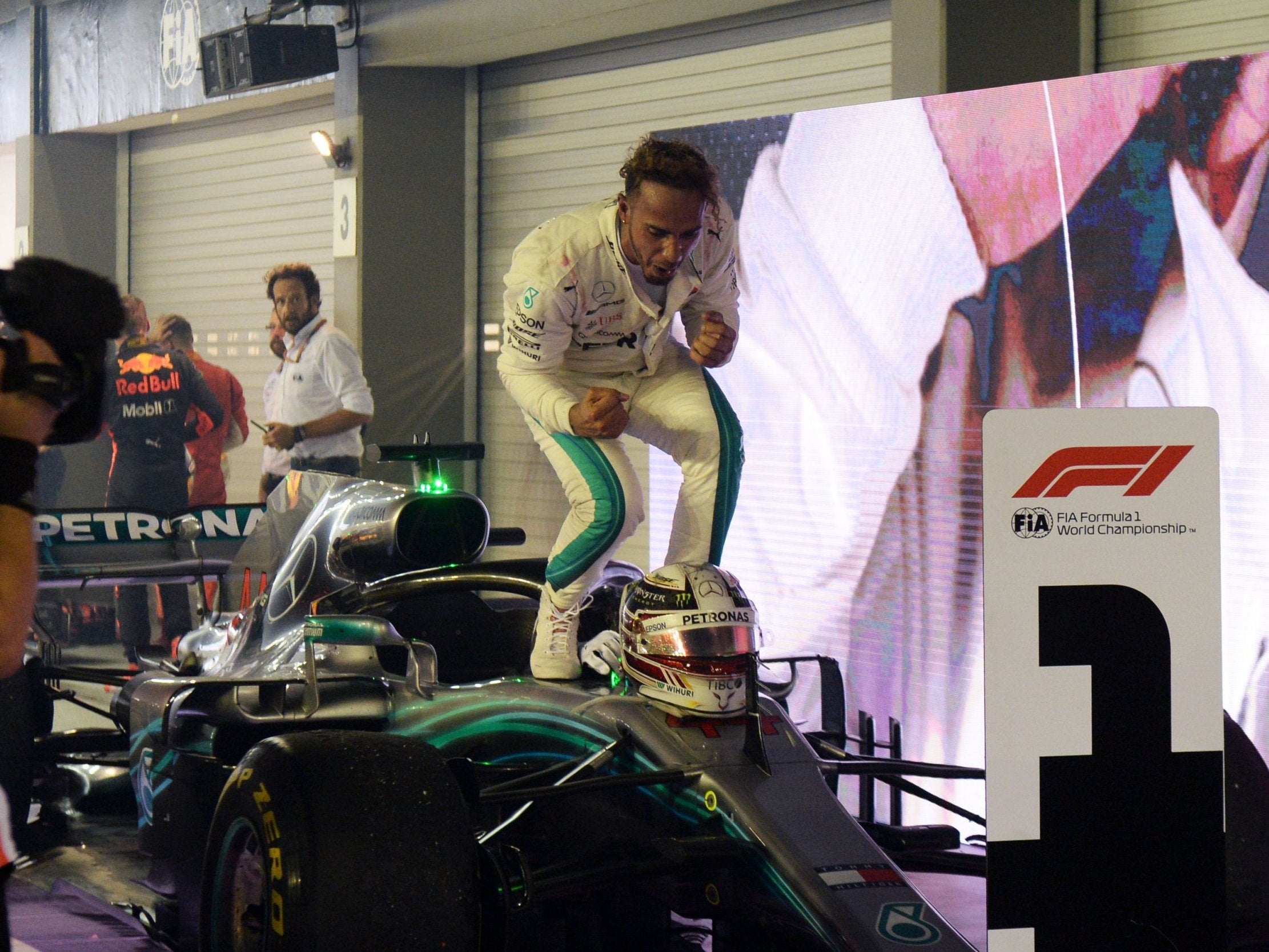 Lewis Hamilton celebrates winning the Singapore Grand Prix